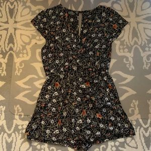 Black with floral pattern romper